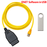 Pack comprenant un câble ENET BMW jaune avec prises OBD2 et Ethernet, accompagné d’une clé USB contenant E-Sys.