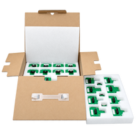 Kit d’adaptateurs BDM dans une boîte en carton ouverte, avec plateau de rangement en mousse blanche.